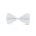 Detail view of a smooth white satin bow tie, showcasing the delicate fabric texture and neat knot. - White (Bulk)