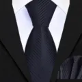 Detailed view of the black striped business tie and matching pocket square fabric texture. - Black Twill