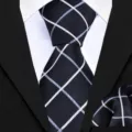 Men's business formal plaid tie and pocket square detail shot showing fine fabric texture. - Business Black Plaid