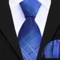 Detail view of the blue plaid necktie and matching pocket square fabric texture. - Business Navy