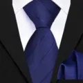 Close-up detail of the deep blue textured twill necktie and matching pocket square set. - Dark Blue Twill