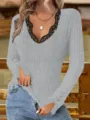 Detailed shot of grey ribbed long sleeve top with black lace V-neck trim worn with denim. - S / Gray
