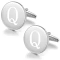 Detailed shot of round silver metal initial cufflinks with engraved letter Q for men's shirts. - Letter Q