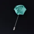 Elegant teal fabric rose lapel pin with silver metal stem, perfect for weddings and formal events. - Teal
