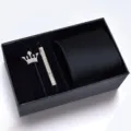 Detailed showcase of mens formal black tie set with crown brooch and tie clip in gift box - KHVA8007-1A