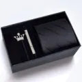 Black men's business tie gift set featuring striped necktie, crown brooch, and metal tie clip. - KHVA8043-1A