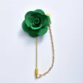Green fabric camellia flower lapel pin with long golden chain design for wedding suit decor. - Green