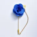 Blue camellia lapel pin with chain, elegant fabric flower brooch for wedding suit and groom decor. - Blue
