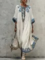 Bohemian style long sleeve dress detail showcasing intricate blue floral prints and loose fit. - S / White