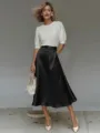 Close-up detail showcasing smooth satin texture and elegant drape of black midi skirt. - S / Bottoms / Black