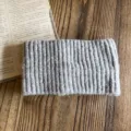 Detailed view of the cozy gray wool blend knitted headband, showing fine ribbed texture. - Gray
