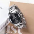 Detailed view of the silver quartz men watch featuring a sleek metal bracelet and dial. - Men Black Dial Silver Strap