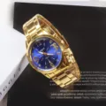 Detailed view of luxury gold quartz watch with blue dial, elegant design for men. - Men Dark Blue Dial Gold Strap