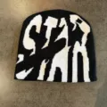 Detailed view of the black and white knitted beanie featuring bold streetwear typography. - M (52-60cm) / Black and White
