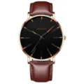 Minimale Quarzuhr mit schwarzem Zifferblatt goldenen Indizes und braunem Lederarmband Alltag - Gürtel Brauner Gürtel Rosa Muschel Orange Nadel