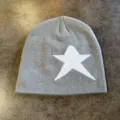 Close-up detail of gray knit beanie featuring a bold white star pattern for winter warmth. - M (52-60cm) / Off-White