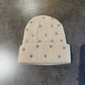 Detailed shot of a beige knit beanie decorated with sparkling rhinestones for warm daily wear. - M (52-60cm) / Rhinestone Beanie / Beige