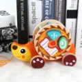 Wooden cartoon snail pull-along toy with shape sorter blocks for toddler early education. - Hedgehog