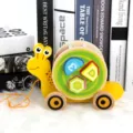 Wooden pull-along snail toy with shape sorting blocks for toddlers, educational walking toy. - Snail Style