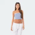 Close-up view of a stylish color-block strapless bandeau crop top worn by a model. - S / Lavender