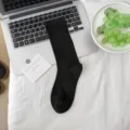 Solid black long socks for women, basic style, soft cotton fabric, versatile everyday wear. - Black