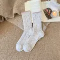 Cozy wool blend mid-calf crew socks with cable knit texture and pink ribbed cuff for winter. - One Size / Off White