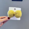 Dreidimensionale Stoff gepolsterte Karo Schleife Haarklammer fuer Maedchen gelbes Haaraccessoire. - Gelb