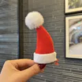 Kids cute red Christmas hat hair clip with white plush pom pom, festive holiday hair accessory. - Stereo Hair Clip (C1) / Dark Red