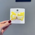 Yellow polka dot fabric bow hair clip with cute lace trim, perfect for sweet daily styling. - Yellow Bow Hair Clip