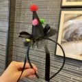 Halloween black witch hat headband with colorful pompoms and mesh bow for party dress-up. - Black Ribbon Headband