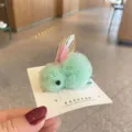 Cute fluffy rabbit hair clip detail featuring soft yarn ball and shiny holographic ears. - Green Hair Clip