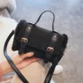 Black plush shoulder bag stylish faux suede crossbody handbag with dual strap buckle decor. - Black