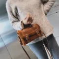 Brown plush and leather crossbody bag with double buckle straps, stylish winter handbag var. - Brown