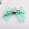 Mint green cherry print bow hair clip, cute fabric hair accessory variant for sweet girls. - Verdant