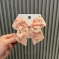 Cute cherry bow hair clip for girls, lovely fabric hair accessory for sweet princess styling. - Orange