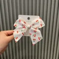 Cute white cherry bow hair clip for girls, lovely handmade hair accessory variant display. - White