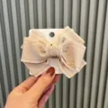 Handmade caramel color fabric bow hair clip for girls, cute 3D hair accessory on card display. - Khaki Solid Color Overlock Style / 1 Piece