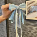 Chinese style girls hair bow clip with long ribbons and tassels, perfect for Hanfu outfits. - Light Blue