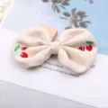 Cute beige bow hair clip with sweet embroidered cherry design, perfect for sweet girls daily wear. - Off White