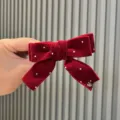 Fermaglio per capelli con fiocco in velluto rosso e strass, accessorio invernale. - rosso mattone