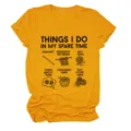 Close-up detail of yellow women short sleeve t-shirt with funny yarn crochet print graphic - S / Tops / Mustard Yellow (Black Text Color Graphic)