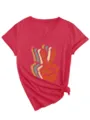 Close-up detail view of red V-neck short sleeve t-shirt featuring retro peace sign print and knot hem. - Red