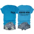 Senior Mom Class of 2027 graduate short sleeve t-shirt, casual comfort blue crewneck top. - S / Tops / Lake Blue (Black Font)