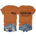 Senior Mom Class of 2027 casual short sleeve t-shirt for women, comfortable crewneck top. - S / Tops / Burnt Orange (Black Font)