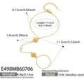 Elegante brazalete de dedo de acero inoxidable dorado con concha, perla y circonita. - Cadena de Dedo Oro Circonia Vieira / 17+5cm