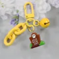Llavero de cadena de acrílico amarillo con colgante de lápida de calavera y bonito timbre. - Estilo 1