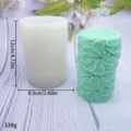 Cylindrical silicone candle mold with detailed floral embossed pattern, perfect for DIY aromatherapy. - Swirl Flower Candle Molds