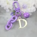 Porte-clés en alliage violet avec pendentif lettre D dorée et chaîne colorée - Lettre D
