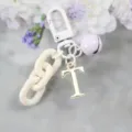 Porte-clés lettre dorée en alliage pendentif sac DIY chaîne blanche charme de cloche de mode. - Lettre T