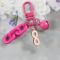 Roze legering sleutelhanger met oneindigheid hanger en ketting, stijlvolle tas accessoire. - Stijl 3